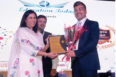 Mr. Amol Arora receiving award at North Educators Summit 2018