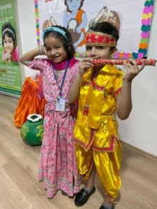 Children in colorful cultural costumes celebrating.