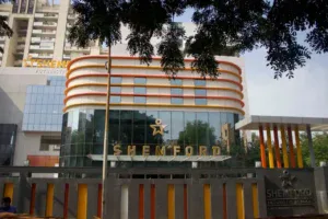 High-rise educational institution in Gurugram with contemporary design and colorful exterior.